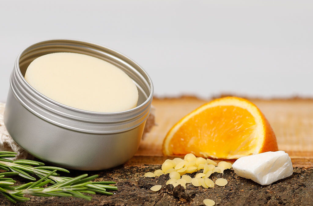 Close-up of a Sugarbush lotion bar tin in natural light